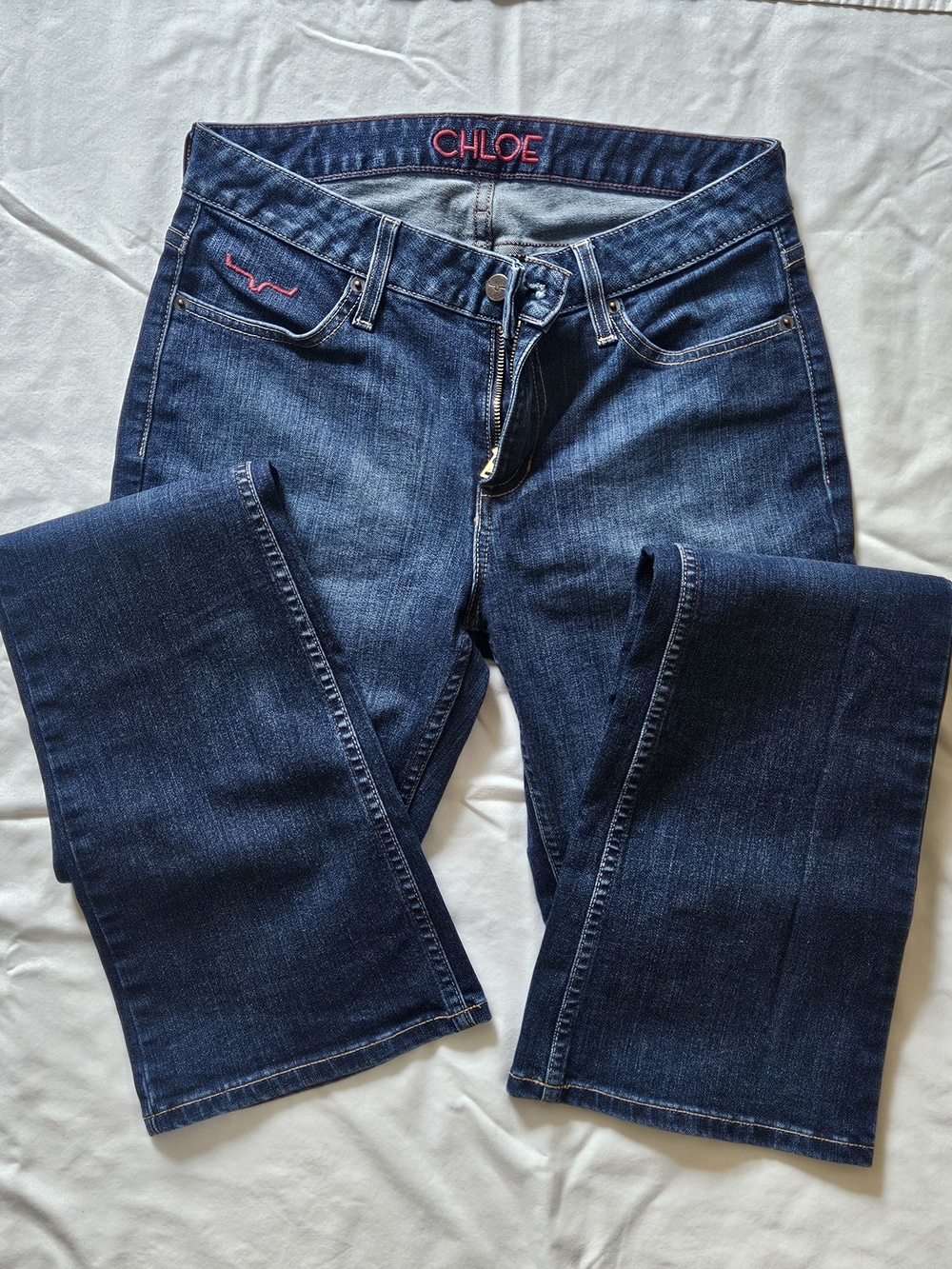 Kimes Ranch Women’s Dark Blue Boot Cut Jeans with Pink Accent